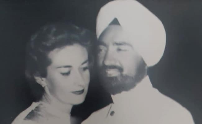 Portrait black and white photo of a couple, possibly dancing