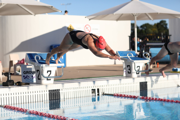Woman dives into swimming pool