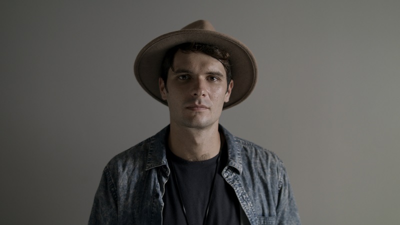 Studio portrait of young man wearing a hat