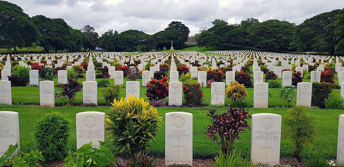 Lines of neatly erected white grave stones stretching off into the distance