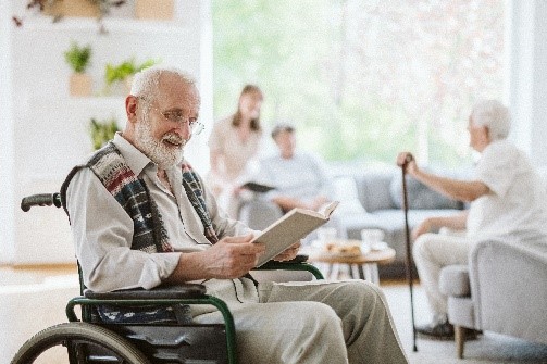 Senior people during afternoon in the nursing home living room.
