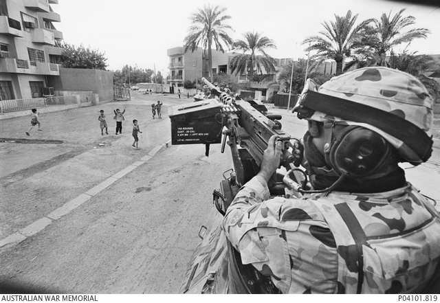 A soldier of the 2nd Cavalry Regiment, in the turret of an Australian Light Armoured Vehicle in Baghdad