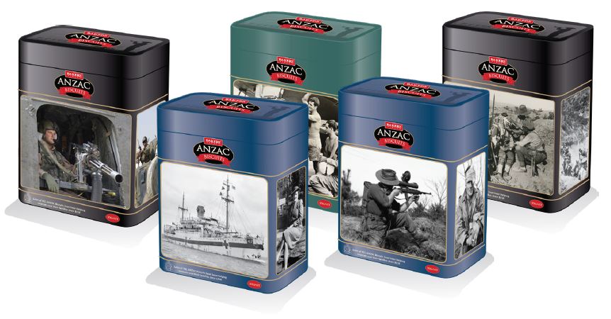 Five Anzac biscuit tins with photos from different conflicts