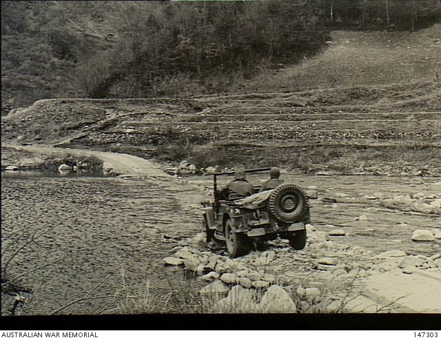 An army jeep crossing one of the river fords to reach the position of the 3rd Battalion, The Royal Australian Regiment (3RAR), in Korea, April 1951
