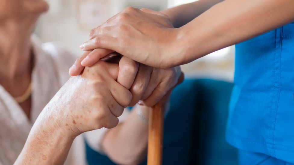 A carer with an elderly person