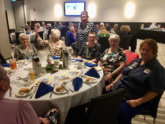 AWW-QLD State President Judy Smith (standing) enjoying Friendship Day with members in Redlands.