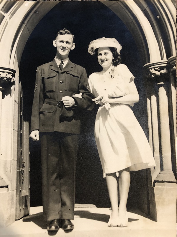 Young couple on their wedding day at entrance to church