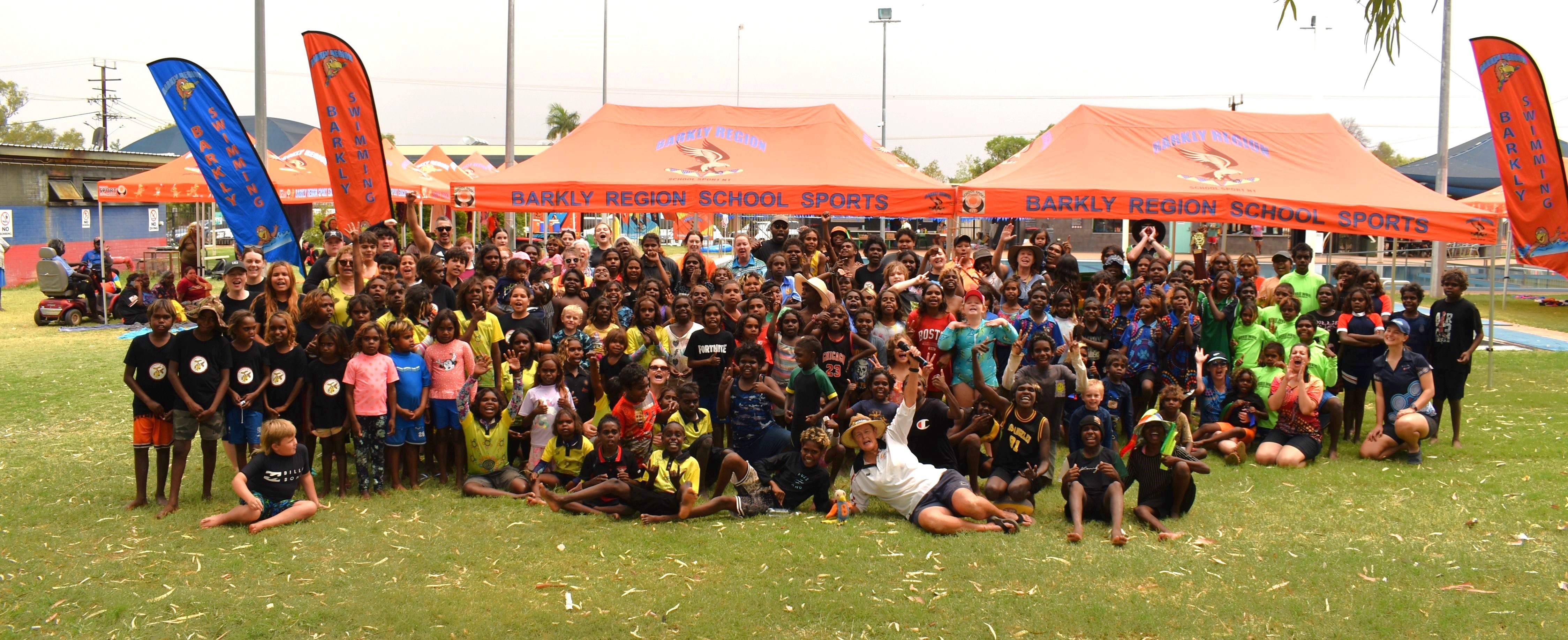 Sergeant Pamela Dillon with students at the Barkly Region Interschool Swimming Carnival in November 2023