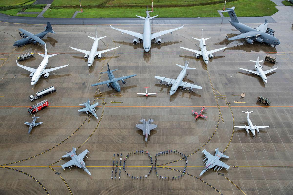 Planes arranged on tarmac along with personnel 