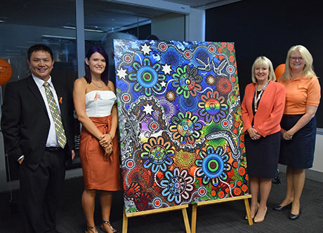 Diversity and Inclusion artist Chern'ee Sutton with the painting and Liz Cosson and other people