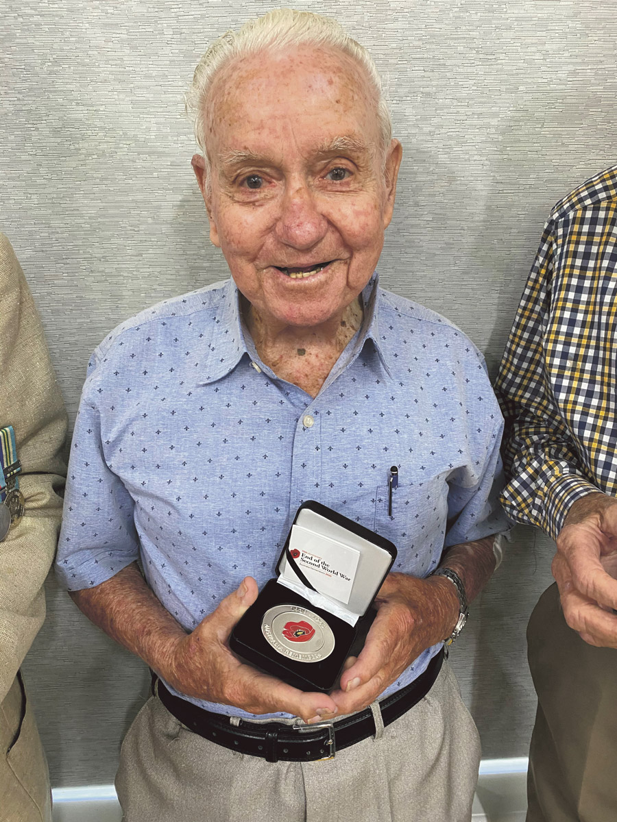 Fred Bainbridge with the Commemorative Medallion.