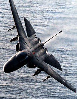 F-111 doing a steep turn over the water