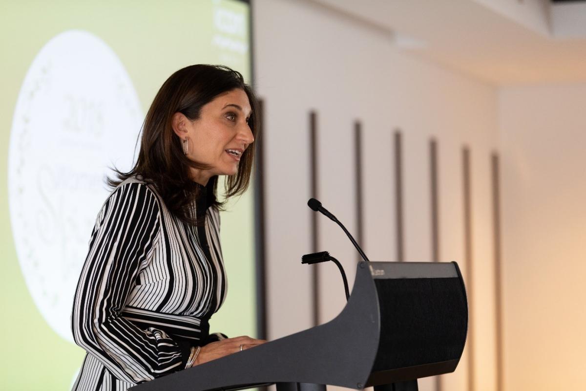 Woman speaking at lectern