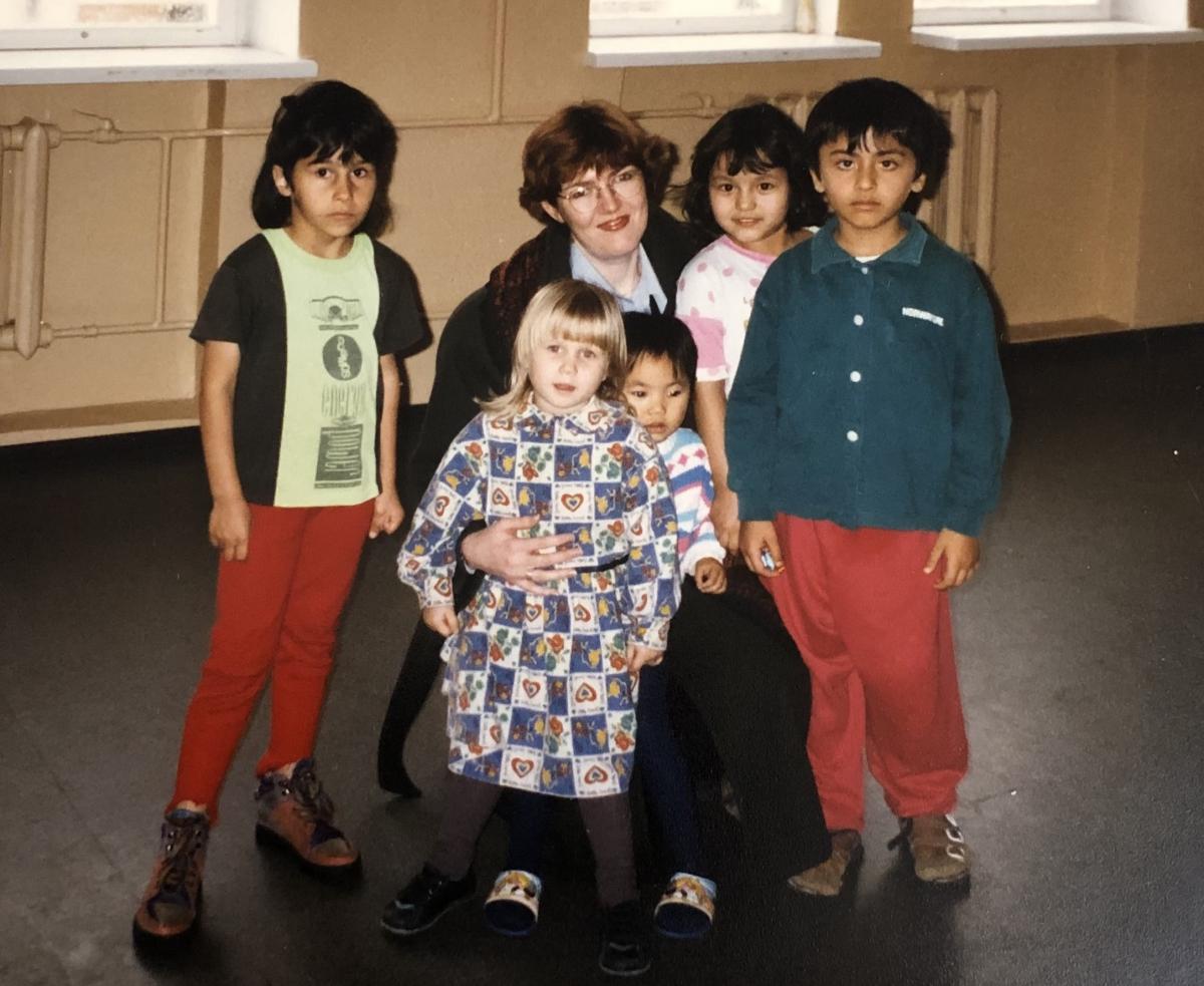 A woman with a group of refugee children in a detention centre in Lithuania, 1997.