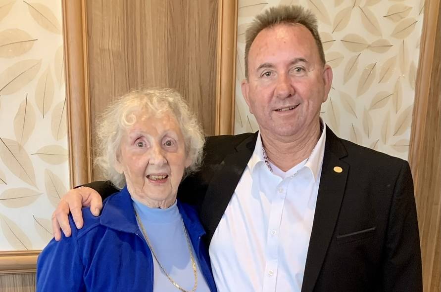 Photo of elderly woman with middle-aged man