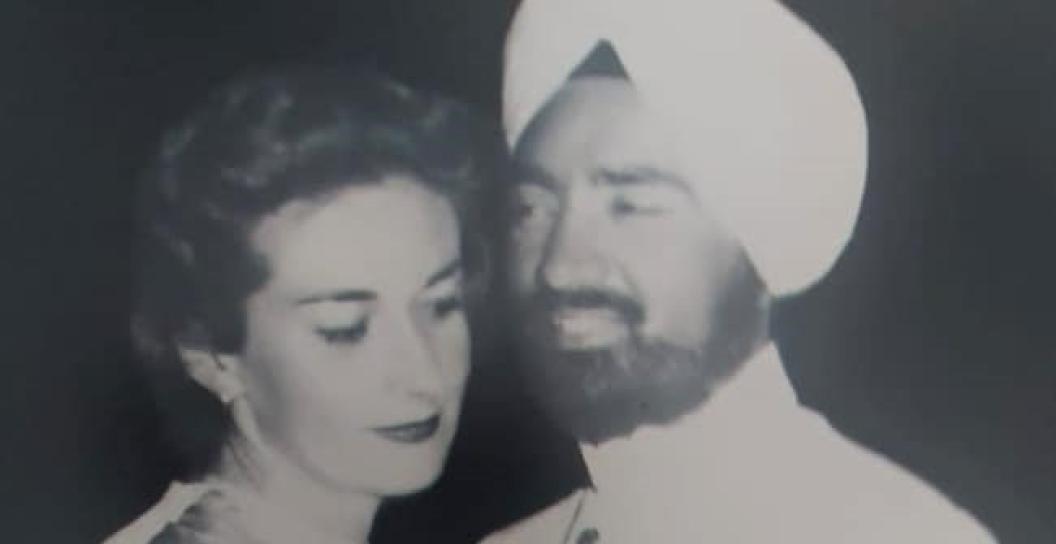 Portrait black and white photo of a couple, possibly dancing