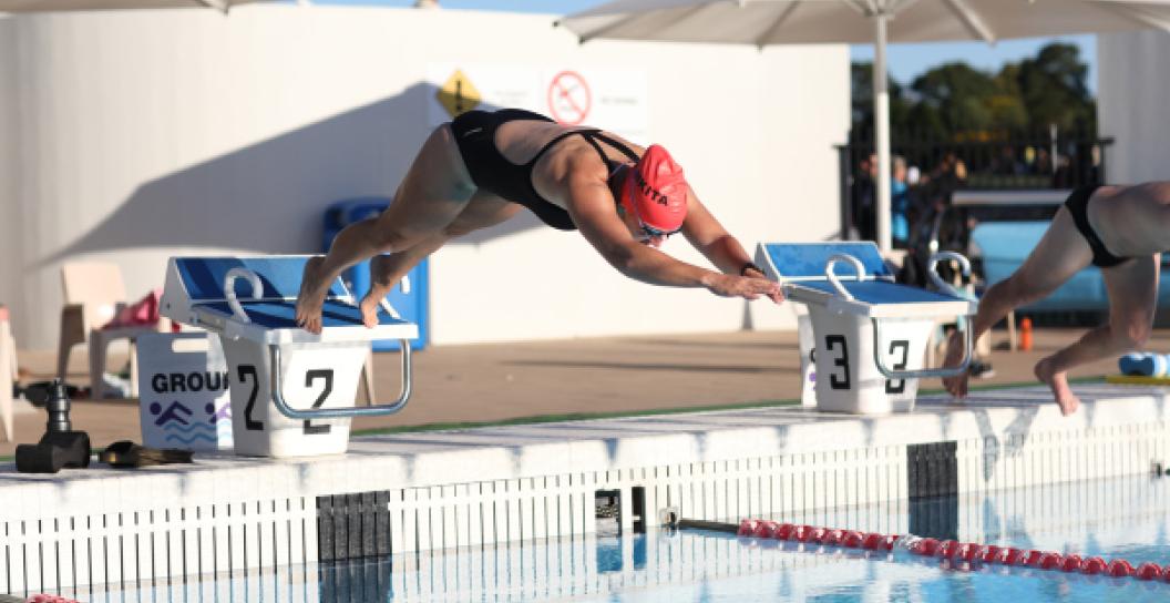 Woman dives into swimming pool