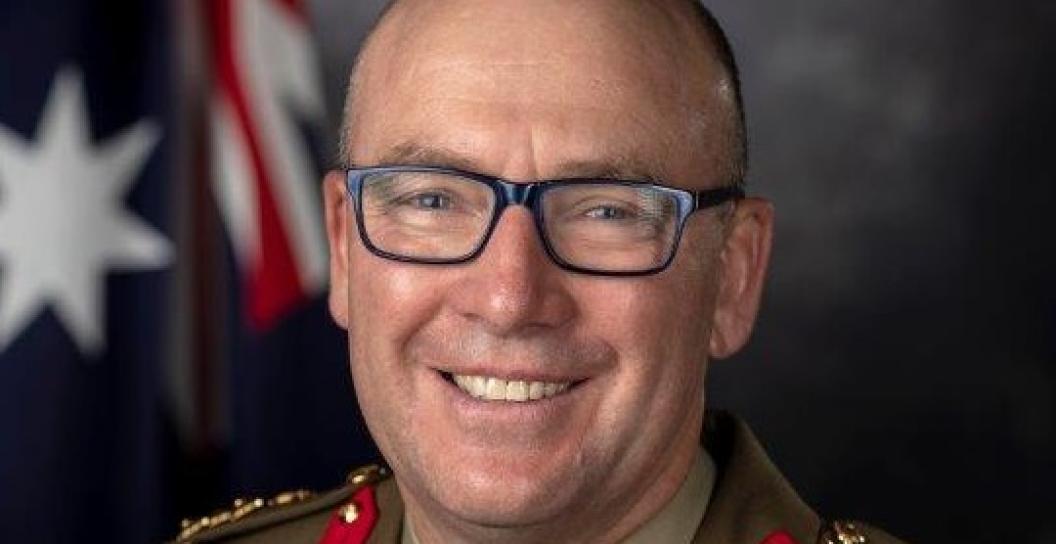 Studio portrait of smiling middle-aged man in Brigadier's dress uniform