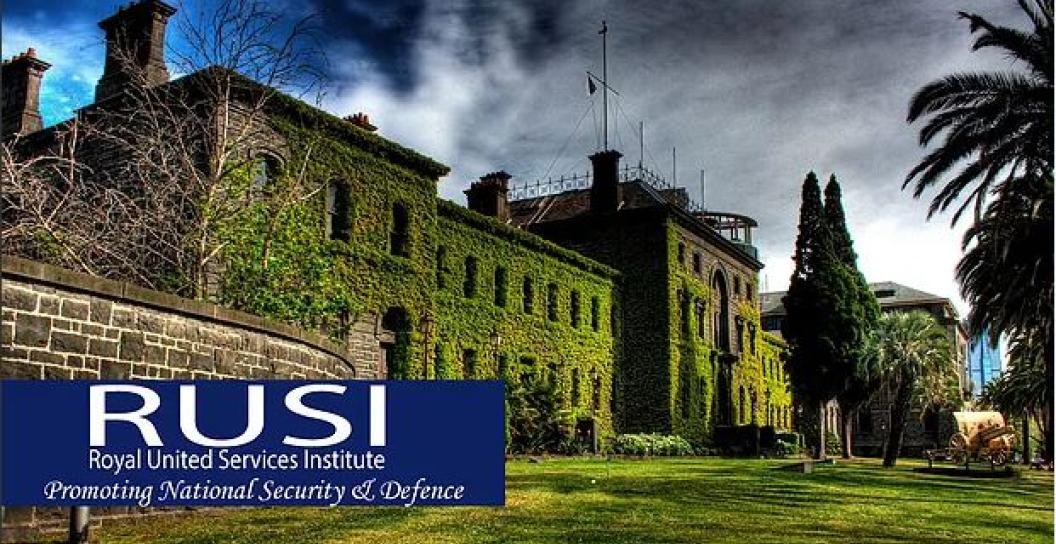 Ivy-covered old building with the RUSI logo superimposed