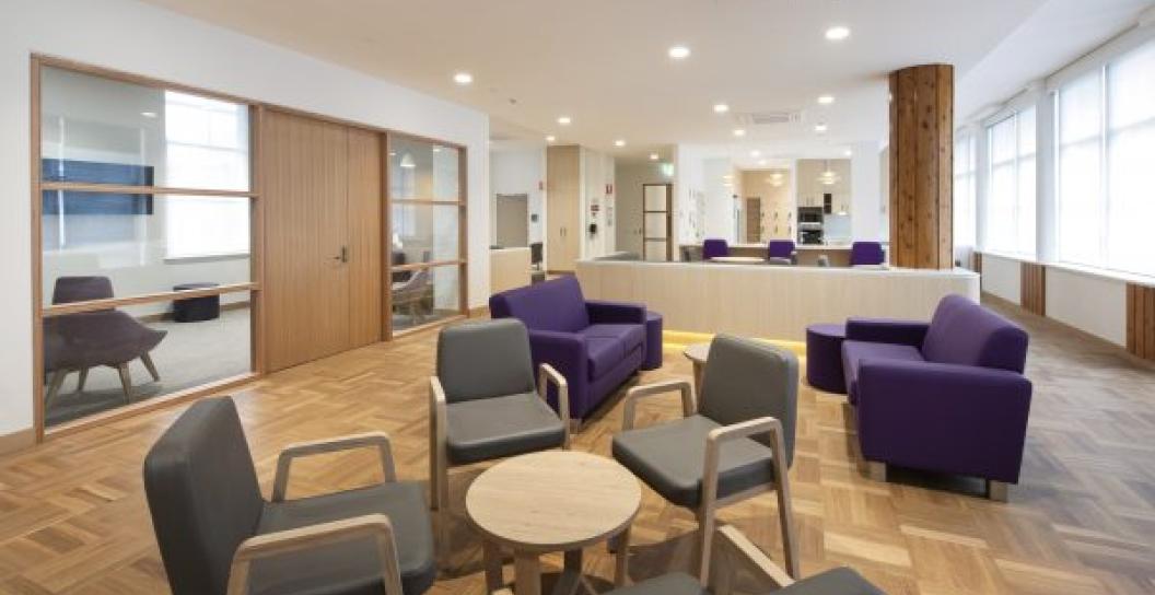 Spacious interior with lounge chairs on timber floor