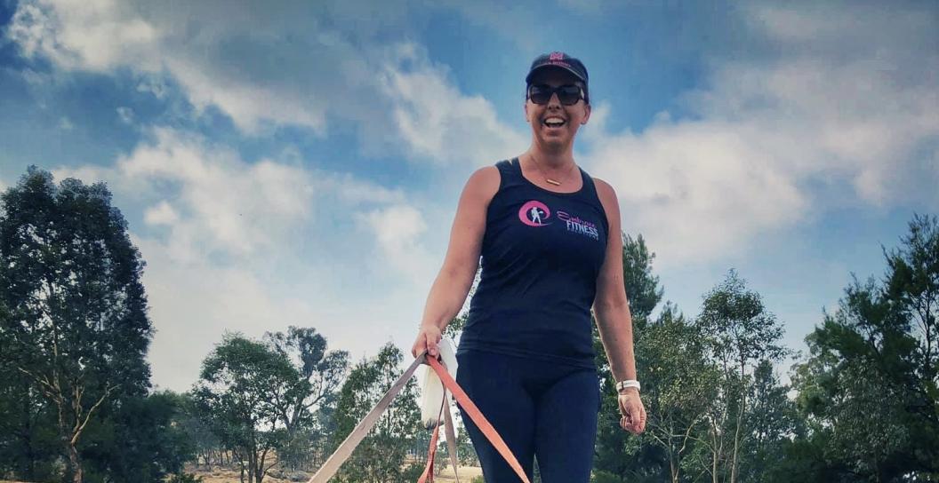 Smiling woman walking dogs