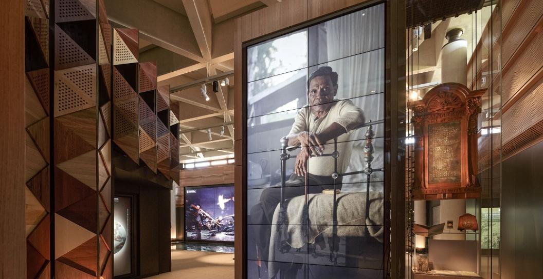 Portrait of an Aboriginal Man in a timbered museum setting