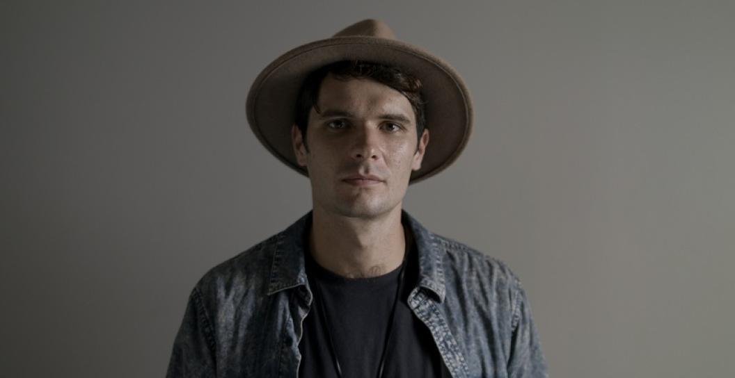 Studio portrait of young man wearing a hat