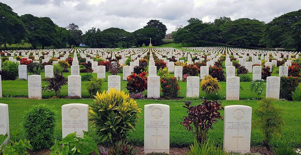 Lines of neatly erected white grave stones stretching off into the distance