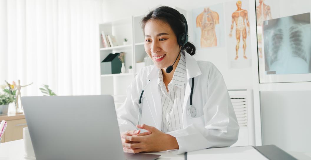 young lady doctor using computer laptop for an online consultation.