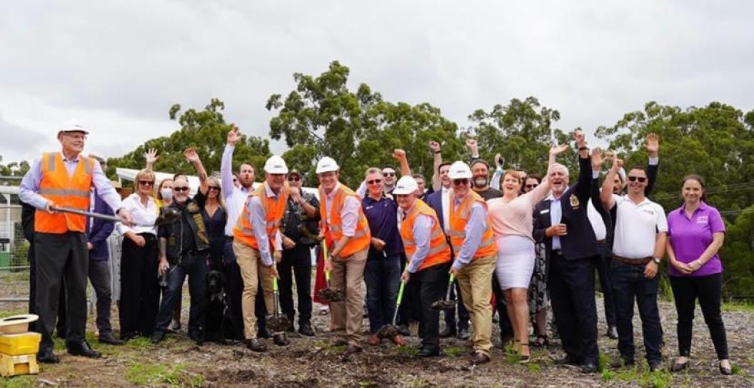 Group of people with shovels digging into the dirty