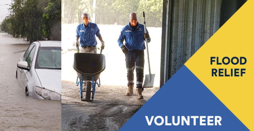 image of two men cleaning up flood affected area