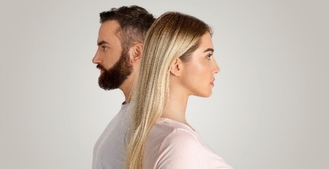 Stock photo showing man and woman looking in opposite directions
