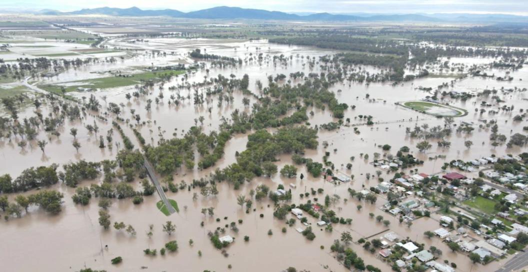 Aerial photo of extensive flooding in town and surrounding bush