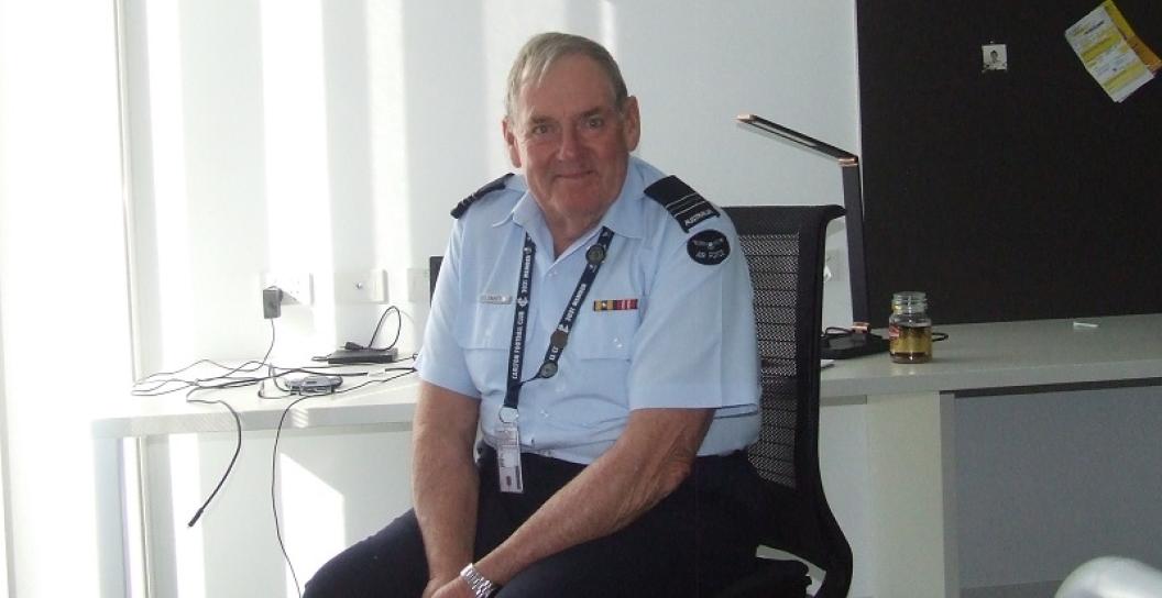 Older man in RAAF officer's uniform in office