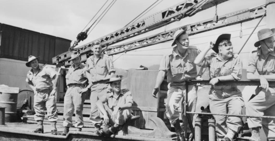 Unidentified Australian servicemen line the decks of the transport or troop ship T120 as it leaves the dock at Kure harbour, Japan, to participate in the first Australian operations in the Korean War.