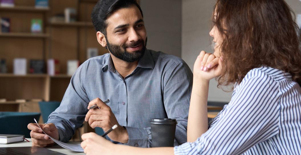 Two people sitting having a discussion