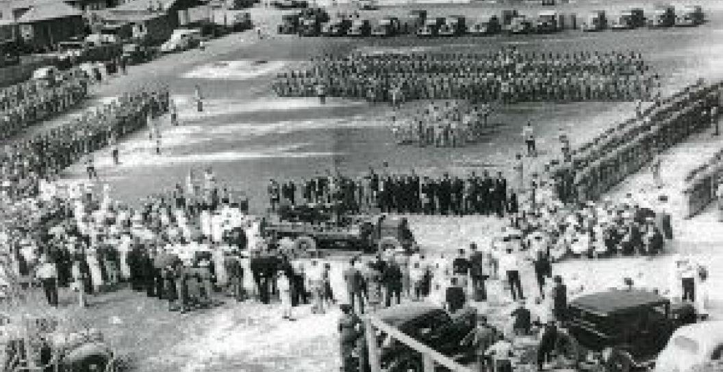 Black and white photo of soldiers parading