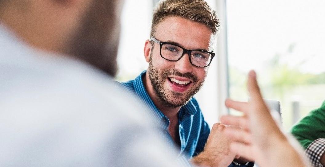 man smiling with glasses