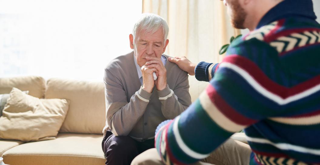 psychologist comforting man