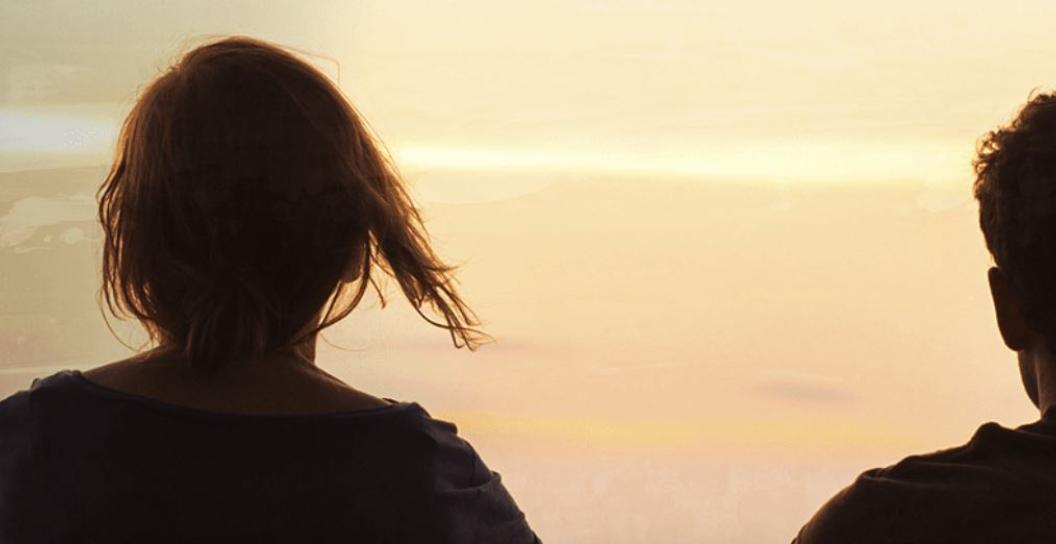 Stock image of two people looking off into the distance