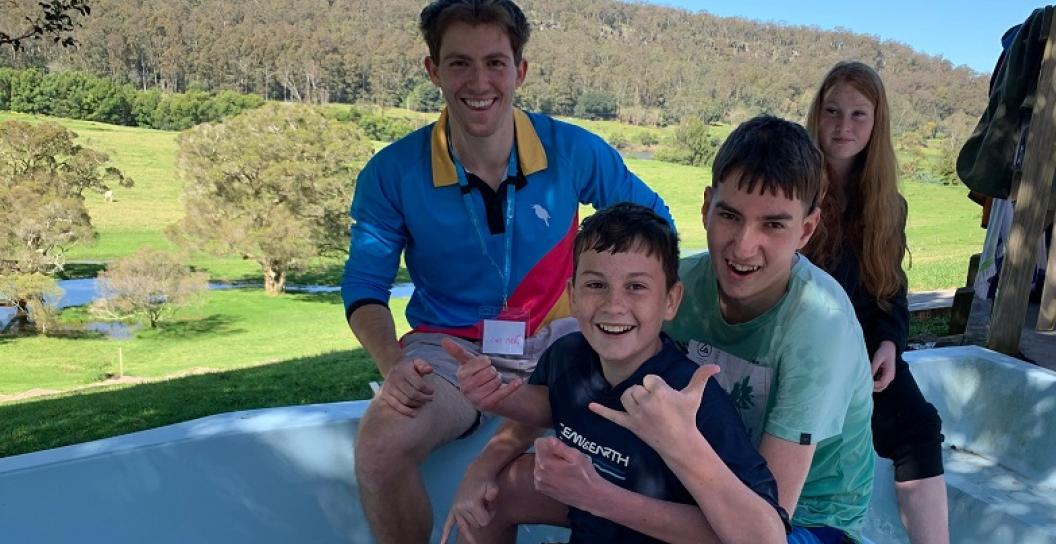Kids smiling on waterslide