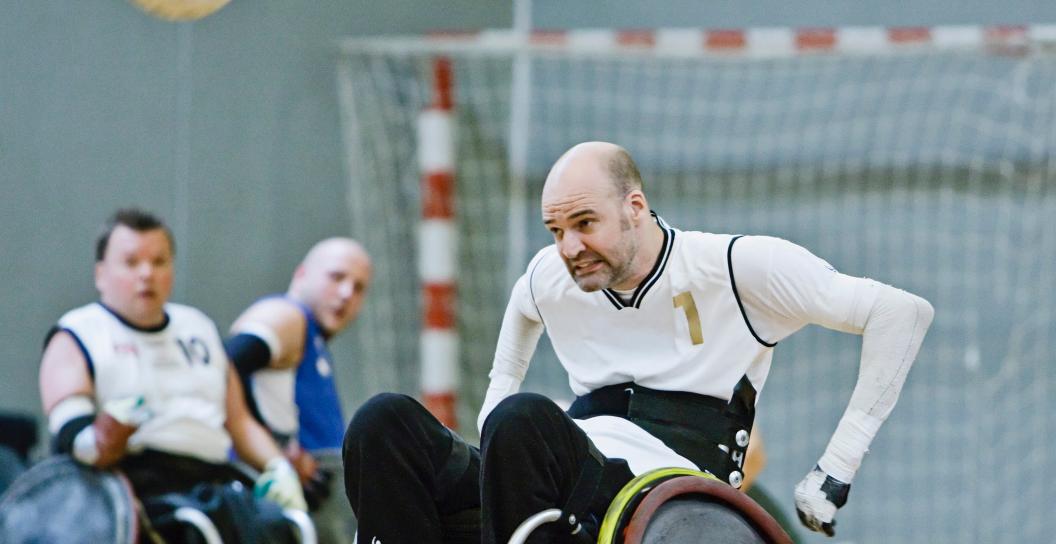 Men playing wheelchair soccer.