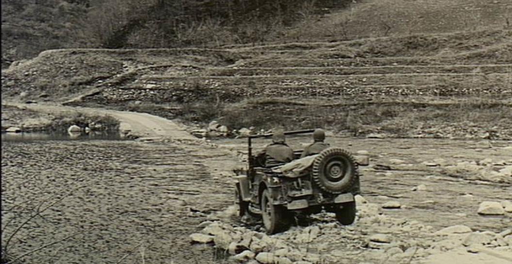An army jeep crossing one of the river fords to reach the position of the 3rd Battalion, The Royal Australian Regiment (3RAR), in Korea, April 1951