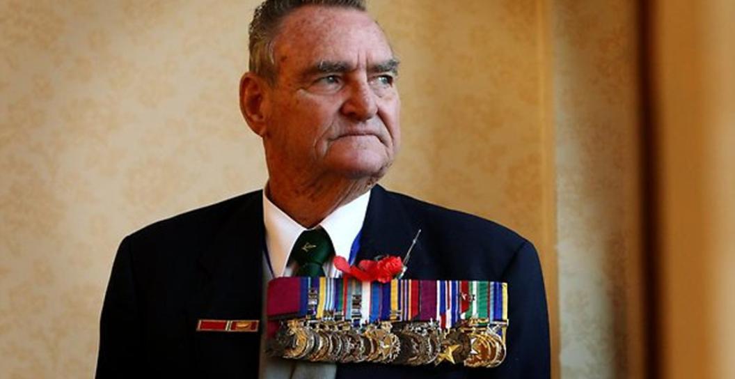 Older man in formal dress wearing large number of medals including the Victoria Cross