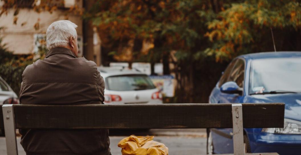 Older man sitting on bench