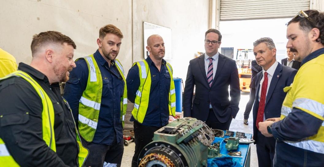 Ministers Keogh and Thistlethwaite with workers in high vis