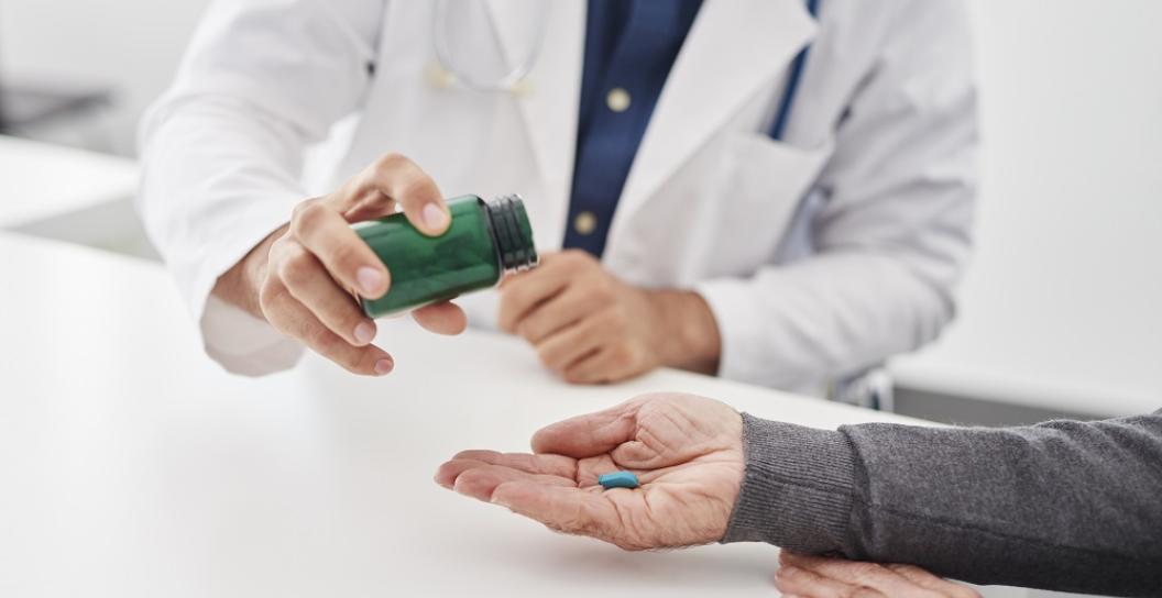 Doctor gives medicine to a patient