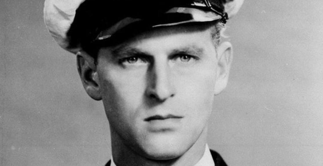 Portrait photo of young man in naval officer's uniform