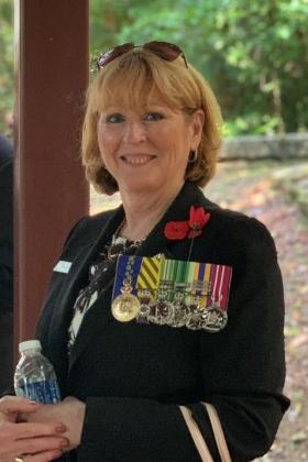 Smiling woman wearing medals