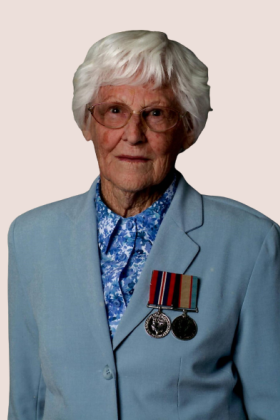 Portrait photo of elderly woman wearing two medals